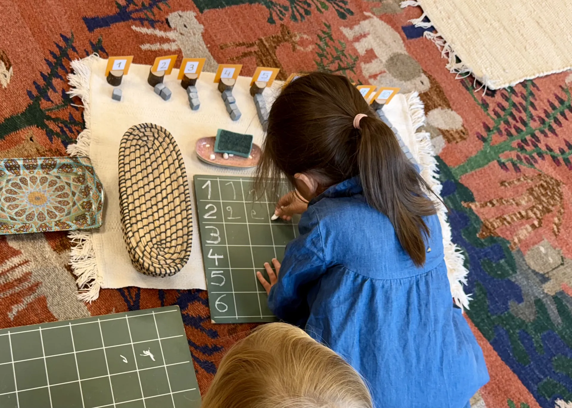 Child working with geometric pattern materials